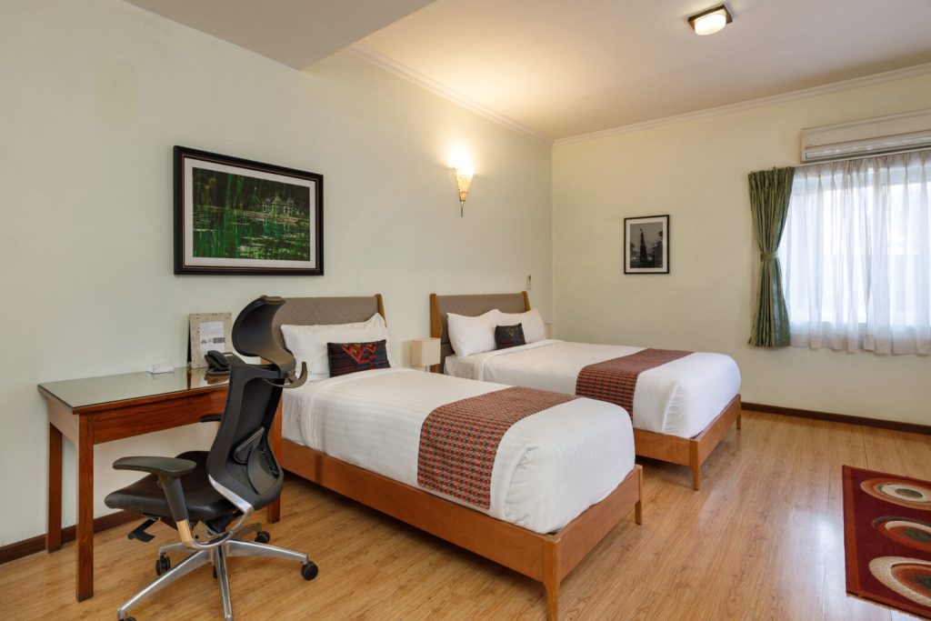 Premier Room Patan Lalitpur bedroom with stylish furniture Premier Room Patan Lalitpur bed room with 2 beds